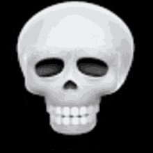 a white skull with black eyes and teeth on a black background