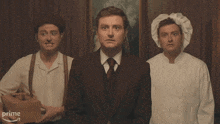 three men are standing next to each other and the word prime is on the bottom right