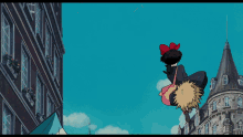 a cartoon of a girl flying over a building with a canadian flag in the foreground