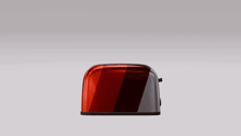 a slice of bread is coming out of a toaster