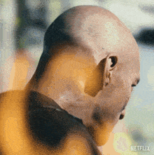 a close up of a man 's head with netflix written on the bottom right