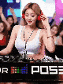 a woman is wearing headphones and playing music on a turntable .