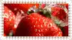 a close up of strawberries with water splashing on them .