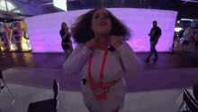a woman with a lanyard around her neck that says eve on it