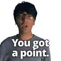 a man wearing glasses and a gray shirt says you got a point