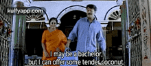a man and a woman are standing next to each other in front of a building . the man is talking about being a bachelor