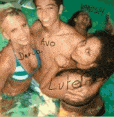 a group of people are posing for a picture and one of them has the name luke on her back