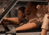 a cartoon character is driving a car and making a funny face
