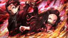 a man and a woman are fighting with swords in a fire .