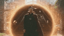 doctor strange is standing in front of a portal in a tunnel .