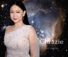 a woman in a white dress is standing in front of a starry sky and the name ghrazie is on the bottom right