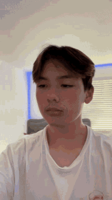 a young man taking a selfie with his phone