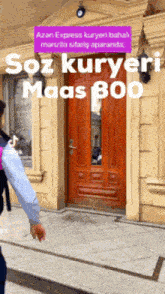 a person standing in front of a door that says ' soz kuryer maas 800 ' on it