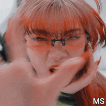 a close up of a woman 's face with the letters ms visible