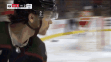 a hockey player is on the ice and the score is 2 to 1