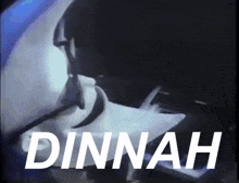 a video of a person playing a piano with the name dinnah written in white