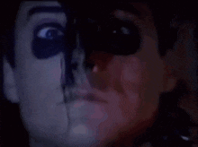 a close up of a person 's face with a skeleton painted on it .