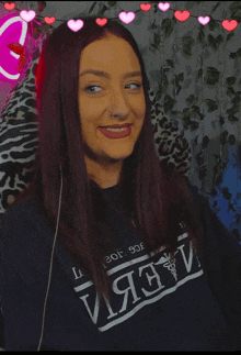 a woman wearing a sweater that says ' crew ' on the front
