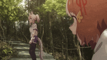 a girl with a ponytail stands next to another girl with a ponytail