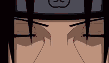 a close up of a cartoon character 's eyes with a headband on his head .