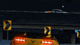 a yellow sports car is driving under a bridge with a sign that says 40 on it