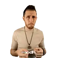 a man making a funny face in front of a white background with mcdh written on it