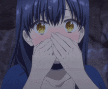 a girl with blue hair and yellow eyes covering her mouth with her hands