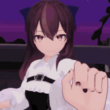 a girl with red eyes is holding someone 's finger