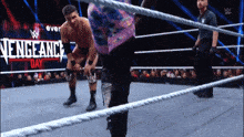 wrestlers in a ring with the words vengeance day on the bottom