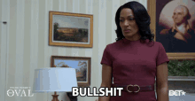 a woman in a red dress says " bullshit "