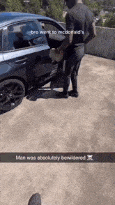 a man is standing next to a car that says bro went to mcdonald 's man was absolutely bewildered