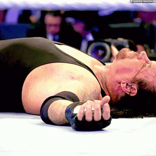 the-undertaker-laying-down.gif