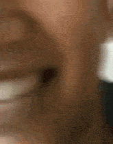 a close up of a person 's mouth with a smile on it .