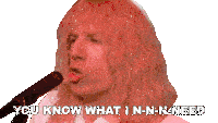a man singing into a microphone with the words you know what i n-n-n-need below him