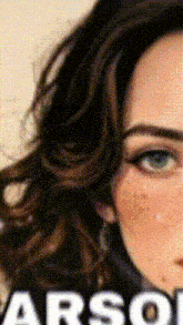a close up of a woman 's face with the word arsol on the bottom right