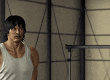 a man in a white tank top is standing in a room with clothes hanging on a rack