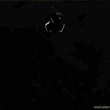 a cartoon character is holding a sword and a light is coming out of it .