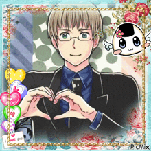 a picture of a man in a suit and tie making a heart with his hands
