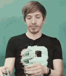 a man wearing a black shirt with the number 8 on it