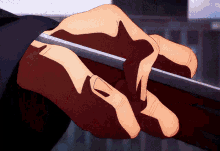 a close up of a person 's hands holding something