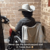 a man in a wheelchair is wearing a cowboy hat