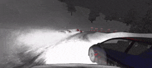 a car driving down a snowy road with arrows pointing to the right