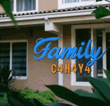 a house with a sign that says family c4h4y4 on it .