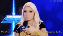 a woman talking into a microphone with the words they always say like the better person was that made the better person did this .