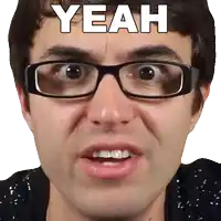 a man wearing glasses is making a funny face and says yeah