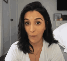 a woman making a surprised face with her mouth open