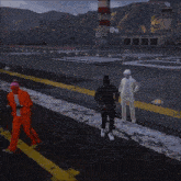 a man in an orange suit is dancing with two other men in white suits