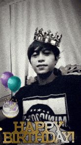 a man wearing a crown and a happy birthday shirt
