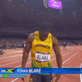 a jamaican athlete named yohan blake stands on the track