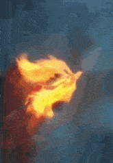 a painting of a person 's face with flames coming out of it 's mouth .